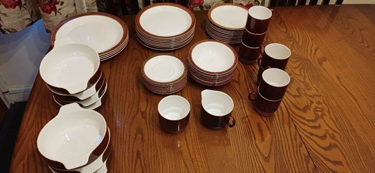 Poole pottery Chestnut plates bowls cups saucers in good condition 