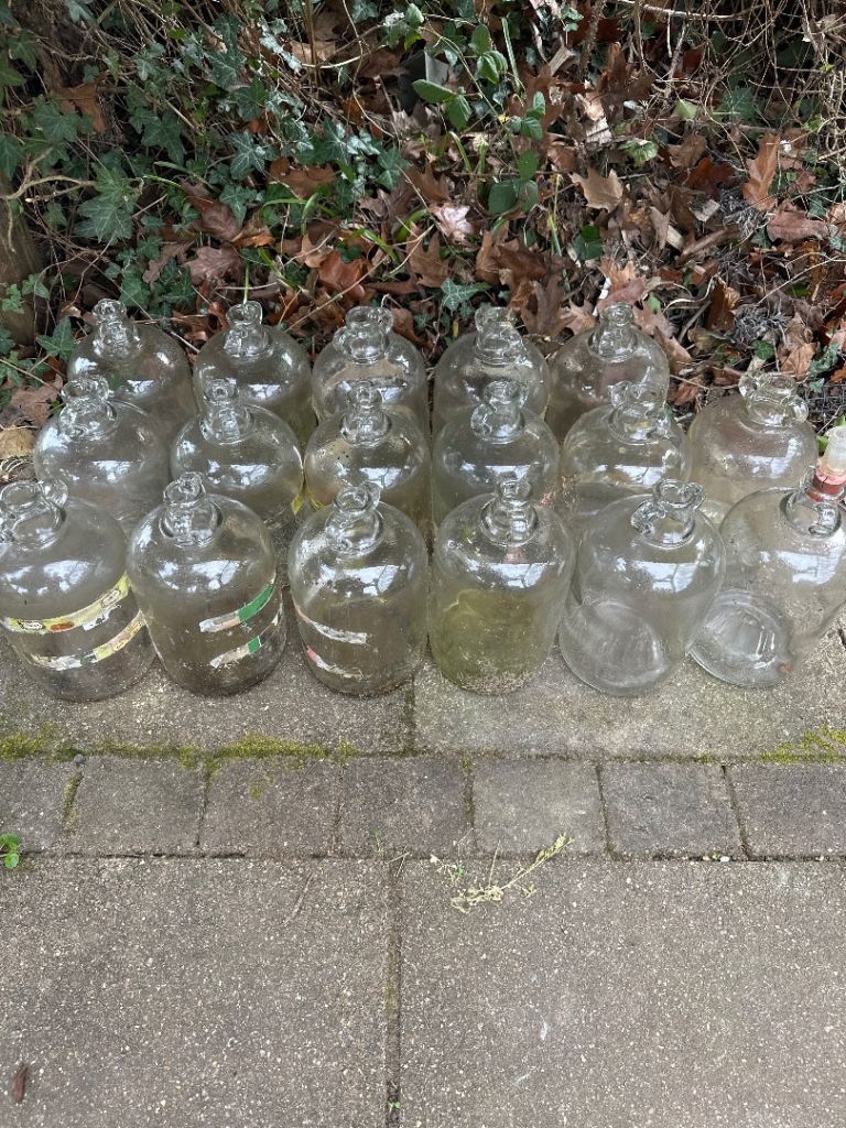 17 Demi John bottles 