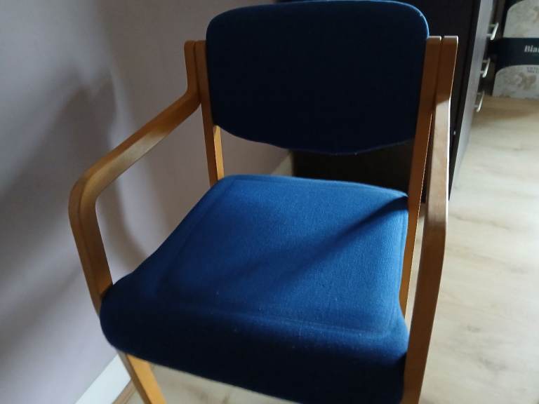  blue stackable wooden chairs 