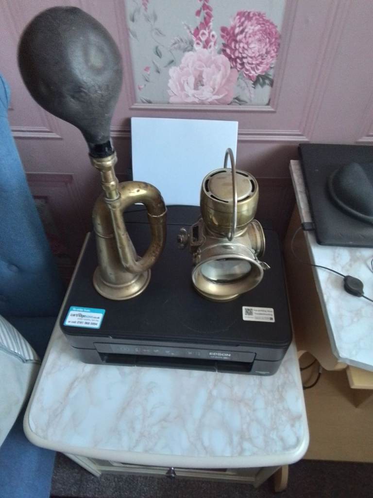 Old brass car horn and lamp