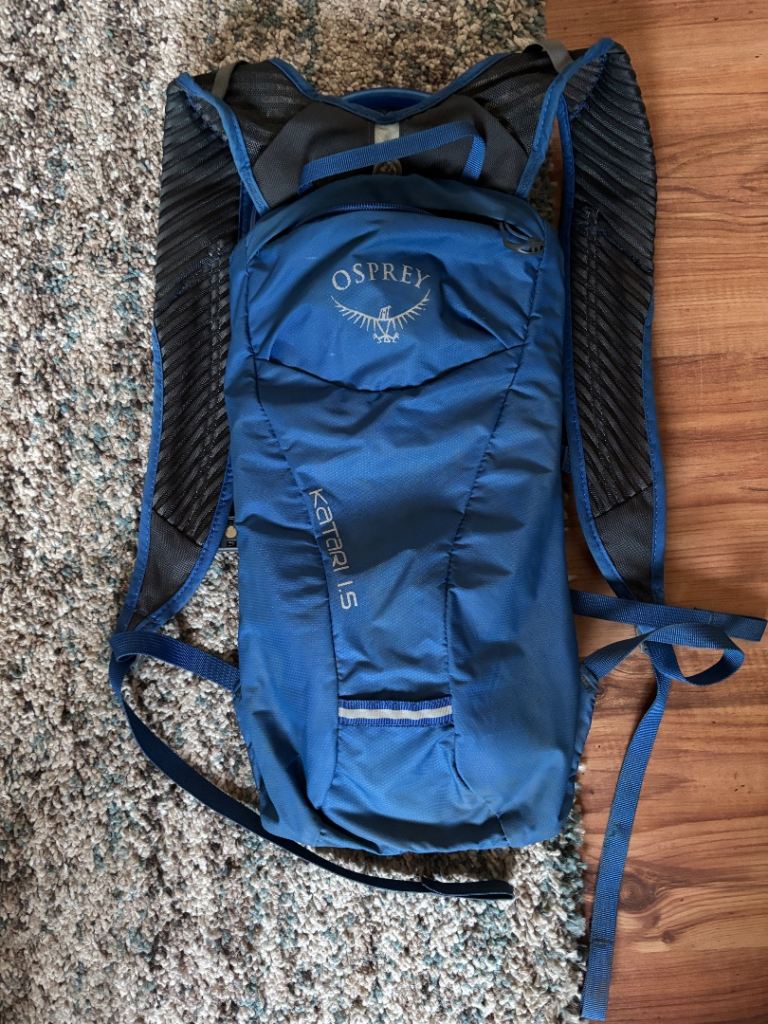 Blue osprey backpack and bladder hydration with mouthpiece