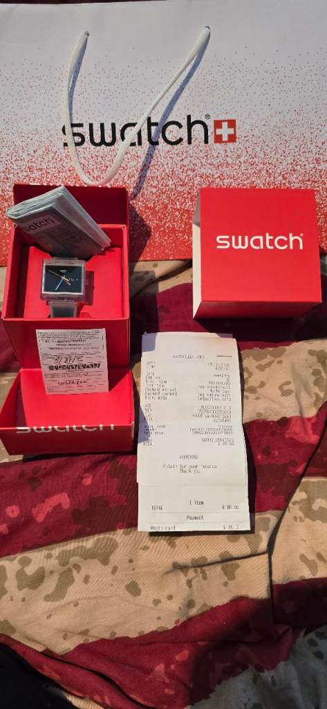 NEW SWATCH SEE THROUGH WATCH BOXED WITH RECEIPT & 2 YEAR WARRANTY