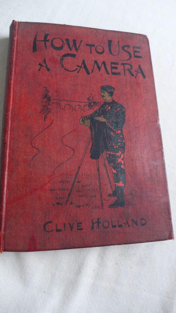 COLLECTABLE ANTIQUE PHOTOGRAPHIC BOOK: HOW TO USE A CAMERA BY CLIVE HOLLAND. PUBLISHED AROUND 1905.