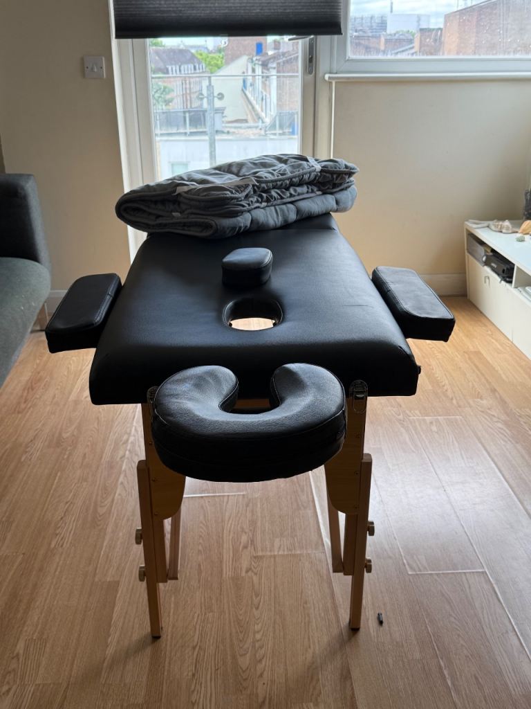 Second hand, light use massage chair with arm and head rest