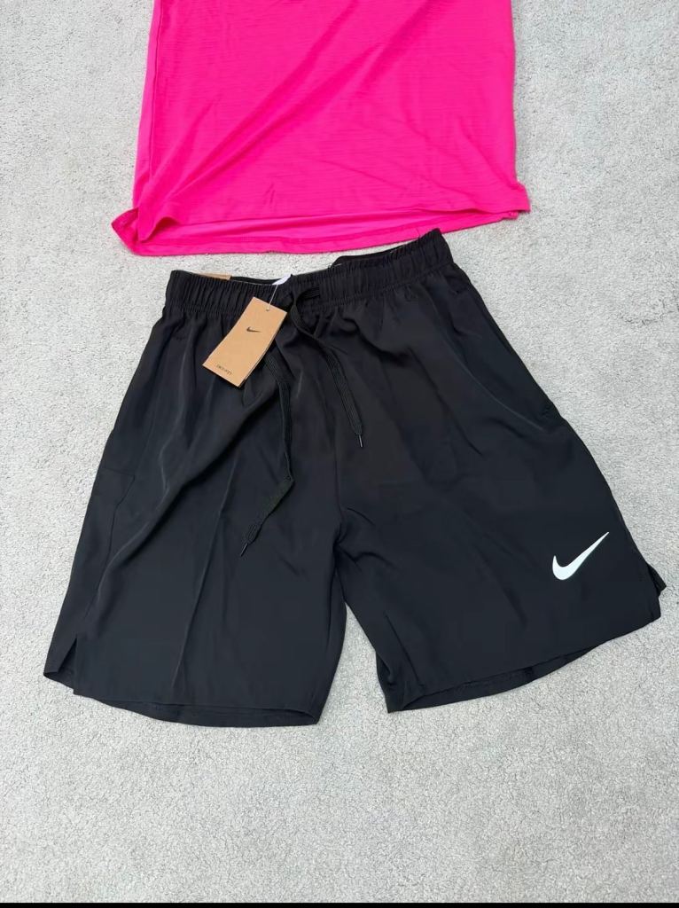 Pink and black Nike miler shorts and shirt small men’s