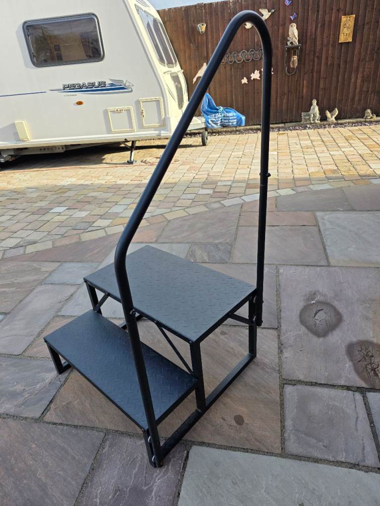 Caravan step with handrail