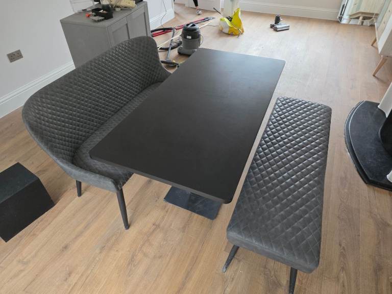 Black dining table with benches