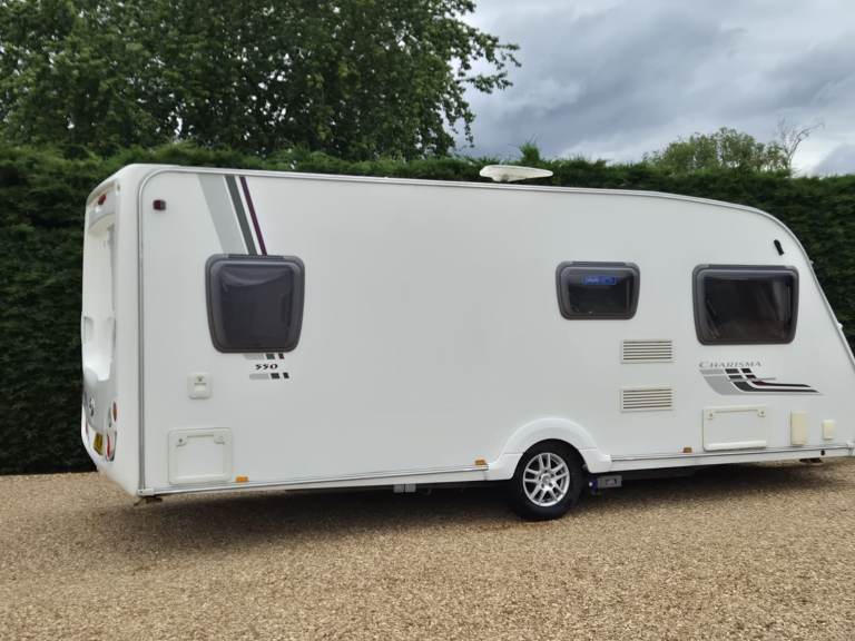 SWIFT CHARISMA 550 2010 4 BERTH FIXED BED CARAVAN + MOTOR MOVER + AWNING