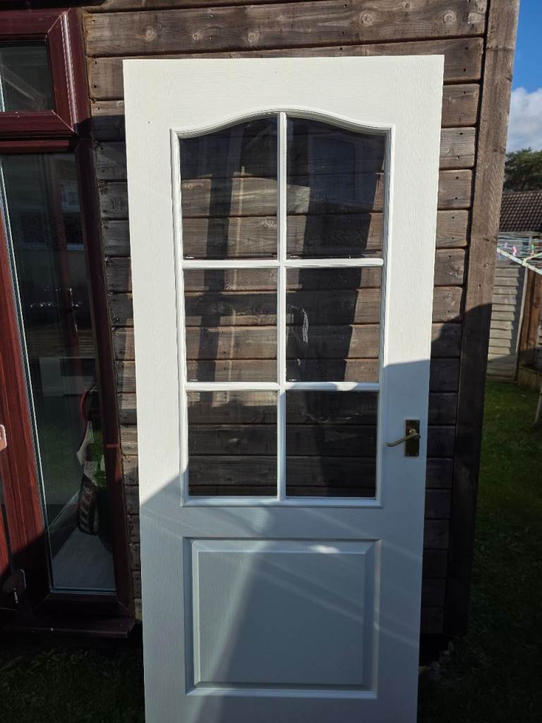 Glass panel interior door