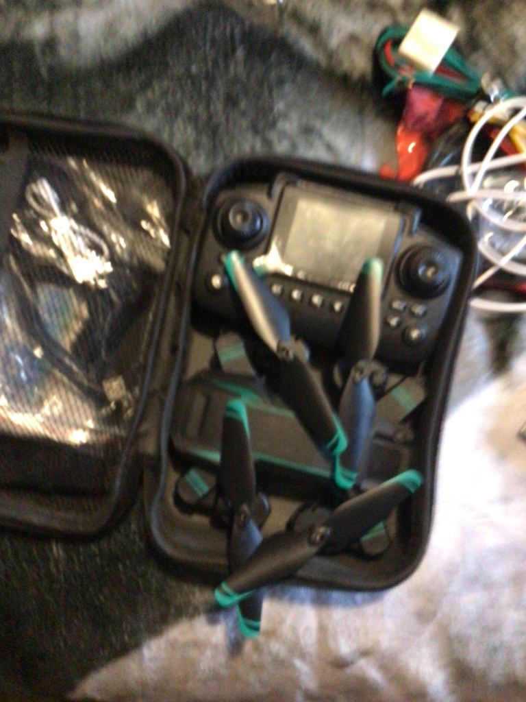 Drone with Controller and Spare Propellers in Carry Case
