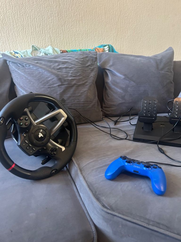 2 PS4 consoles, controller ,games and steering wheel 