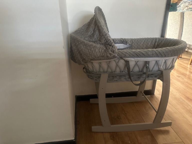 Moses basket, rocking stand and new sheets