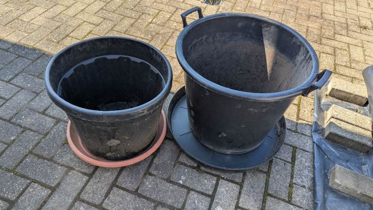 2 x large plastic pots and saucers 