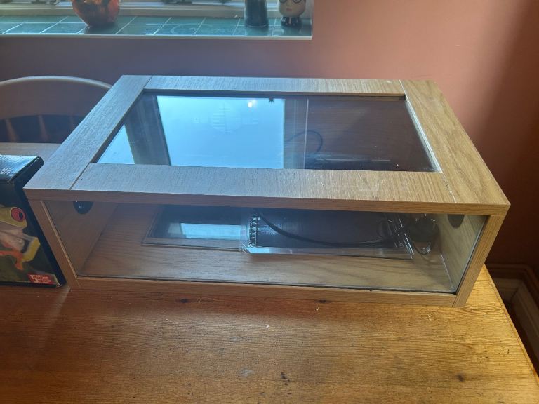 Reptile enclosure with heat pad and thermostat