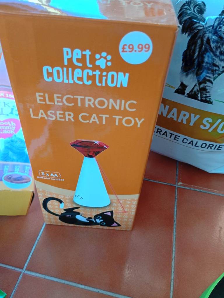 Cat toys and treats inc laser pen and lick e lix
