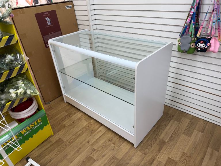 White Retail Display Counter with Glass Shelves – Good Condition