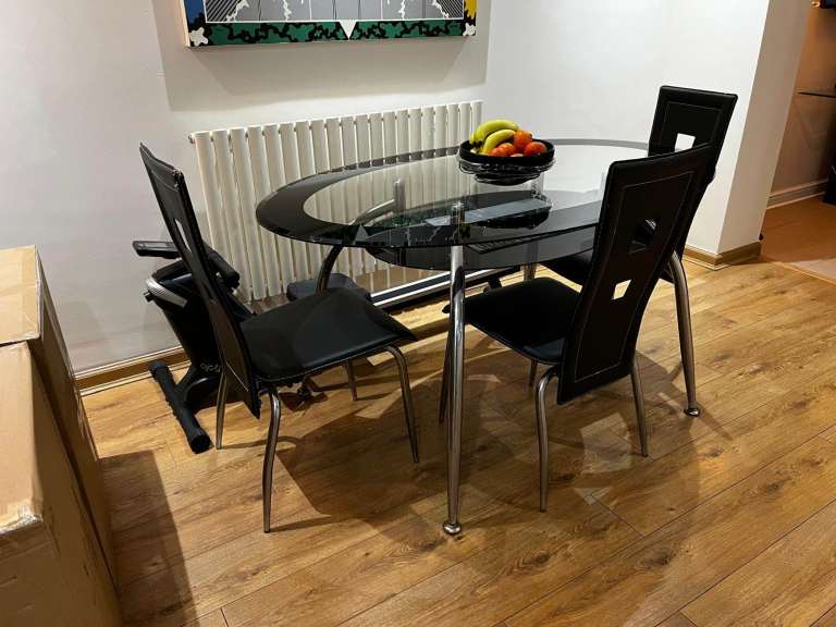 Glass dinning table & three chairs 