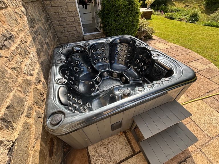 Feature packed 6 person hot tub with  102 hydrotherapy jets, waterfall/fountains, LED, Bluetooth.  