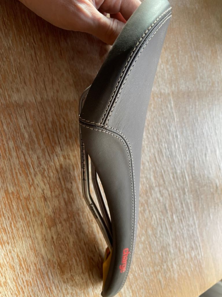 Charge titanium brown bike saddle