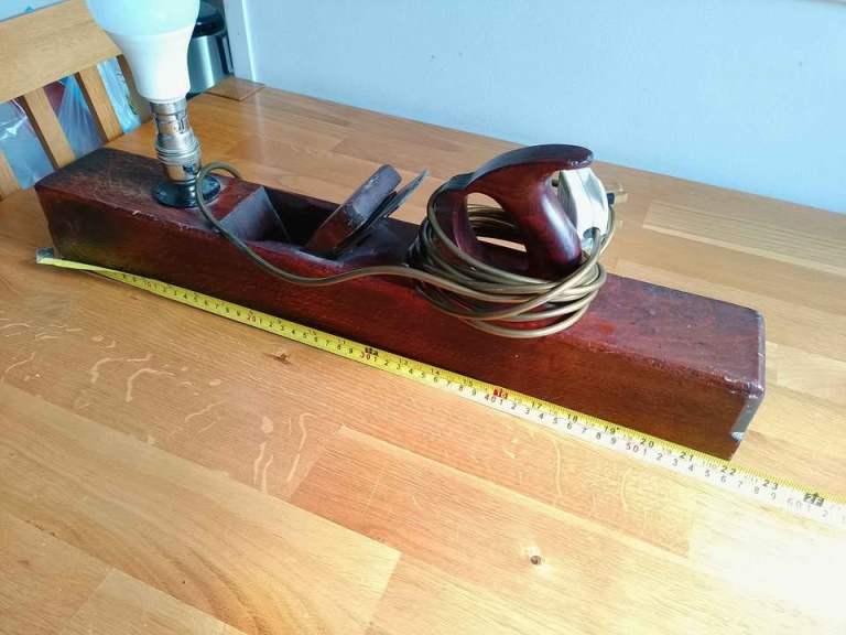 Beautiful, large vintage wooden plane converted into a rustic table lamp