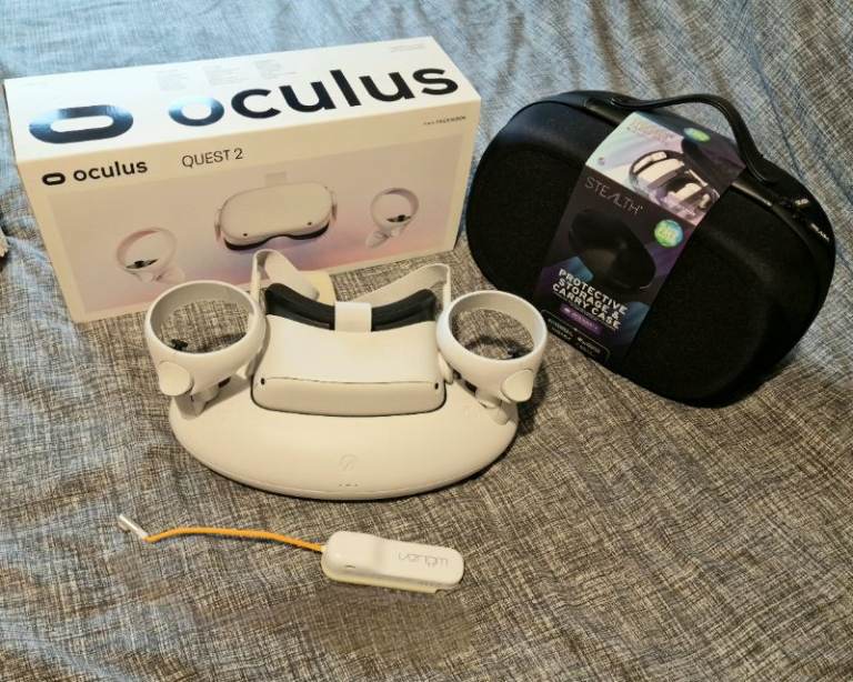 Meta quest 2 boxed with charging dock, new carry case and power bank in excellent condition 