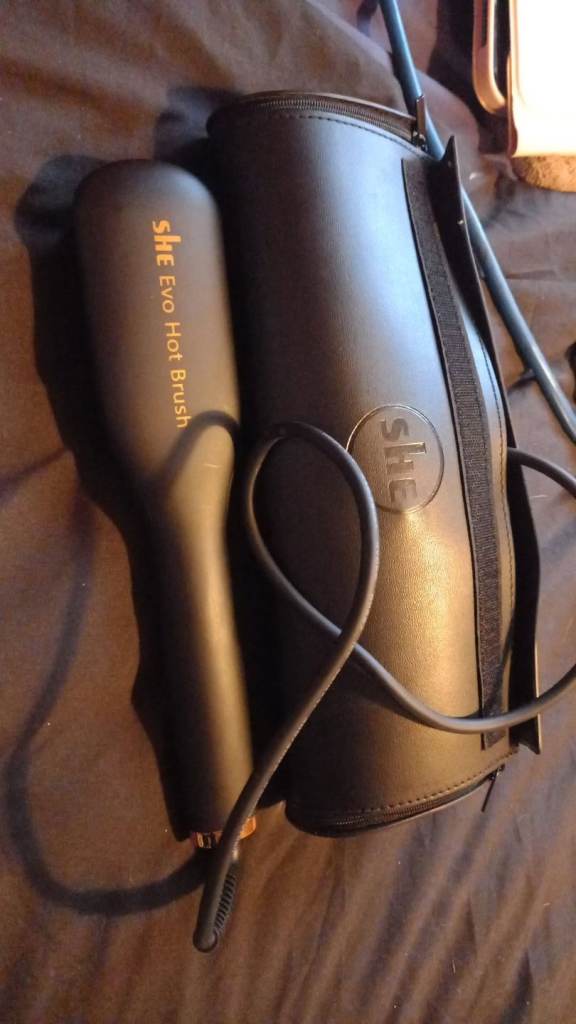 Heated hair straightening brush