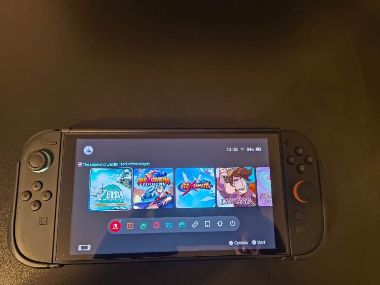 Nintendo switch 2 with 2 controllers, memory card, headset and games 