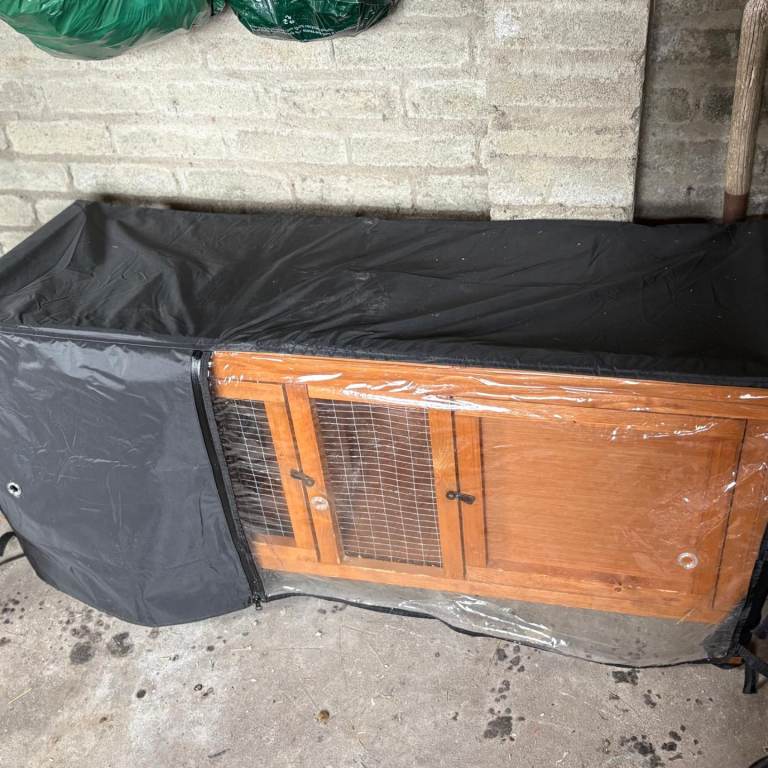 Rabbit hutch with cover. 
