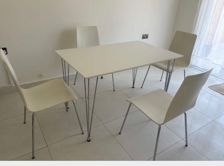 White Dinning table and 4 white chairs 