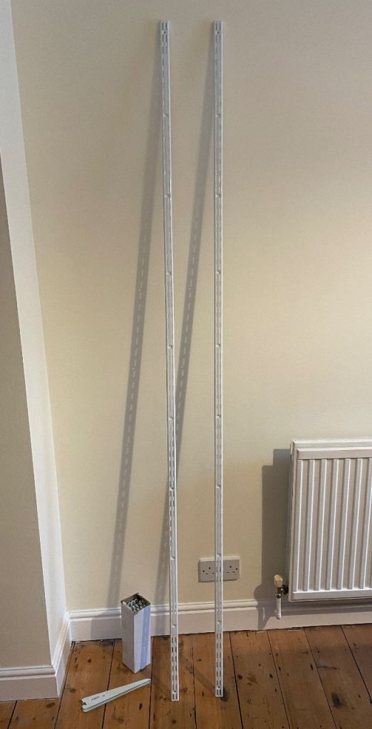 Twin slot shelving uprights and brackets