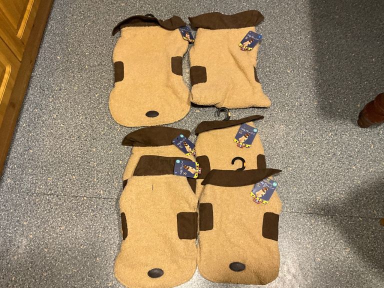 BRAND NEW WITH TAGS, DOG COATS, in sizes medium and large at the moment.
