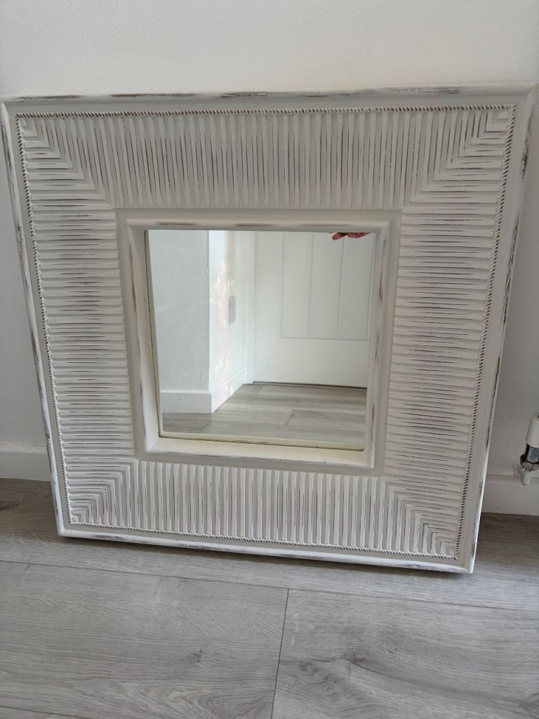 Square decorative wall mirror. 