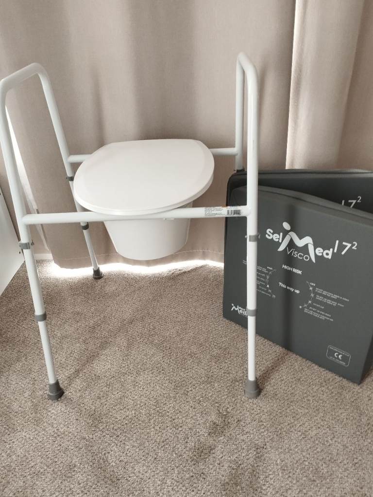 Height adjustable toilet frame and seat plus 2 medical pressure cushoins