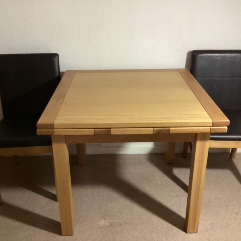 Solid Oak drawer leaf table with 4 dark brown chairs 