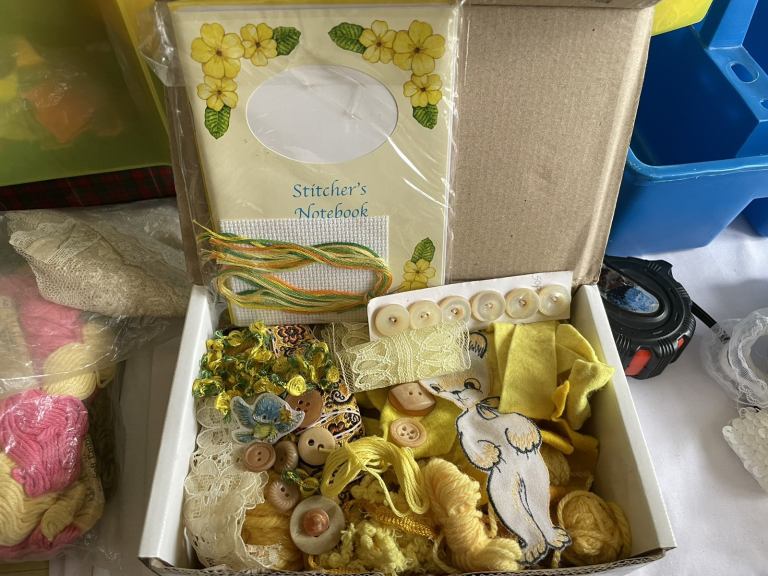 Large box of yellow crafting items