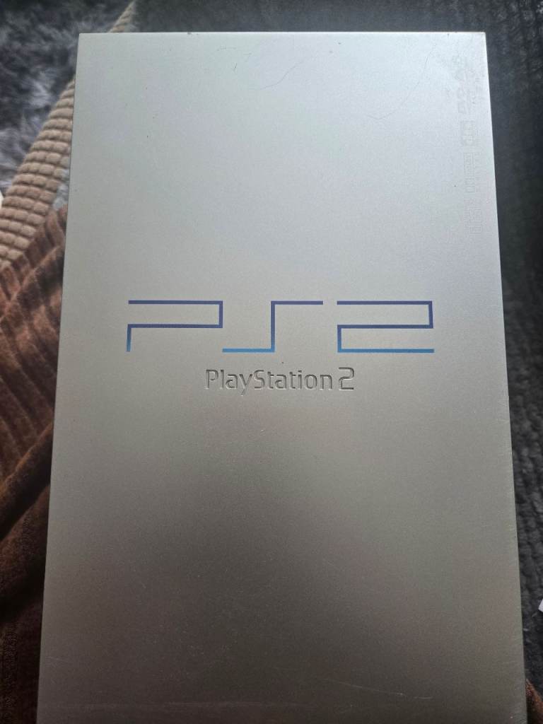 Silver PS2 with silver controller also hdmi and memory card