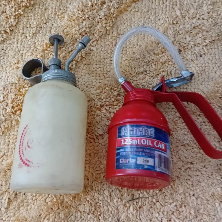 image for oil dispenser PUMP LEVER TO RELEASE THE OIL WHERE YOU WANT IT