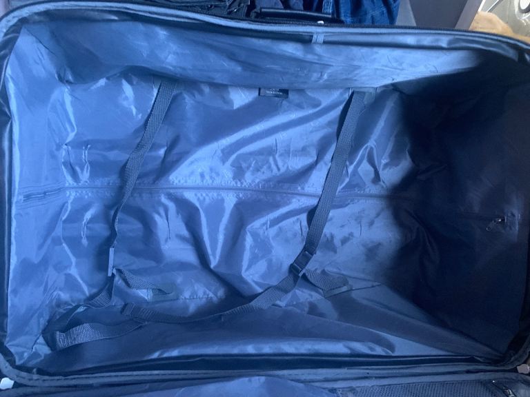 LARGE BLACK/BURGUNDY SUITCASE ON 2  WHEELS