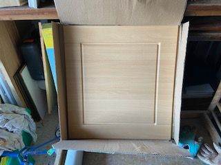 A new beech effect cupboard door 