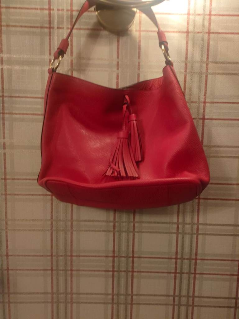 Ladies cherry red Osprey Lonon handbag with tassels. Good condition. Collection only 