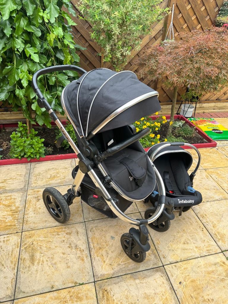 image for Black Infababy pushchair and car seat set and cover 