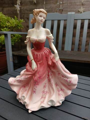 royal doulton figurines pink dress Jemma HN3168 (7 3/4" Tall) holding a rose What does the green stamp