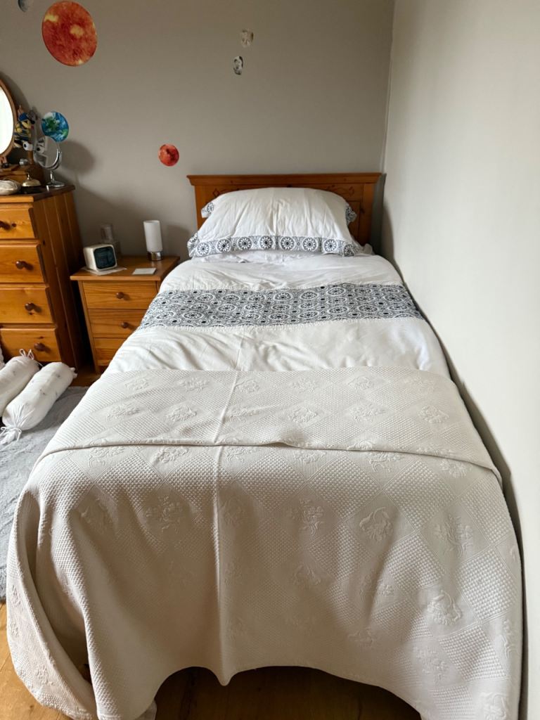 Single bed headboard, mattress with duvet and bedding 