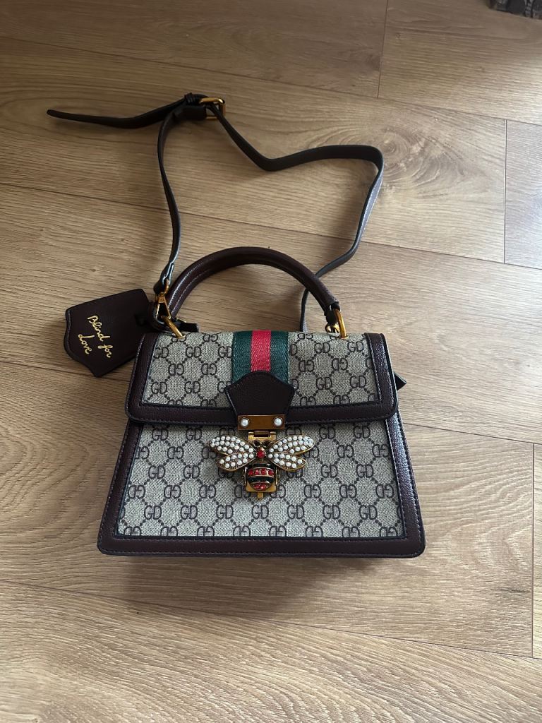 Pretty handbag with jewelled bee fastener