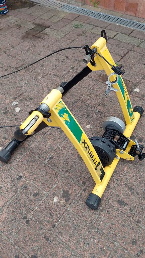 Tranzx bike trainer with wheel