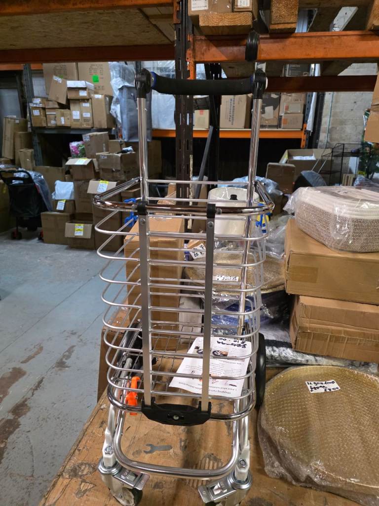 A new metle folding shopping trolly with ajustable handle and 4 wheels . 