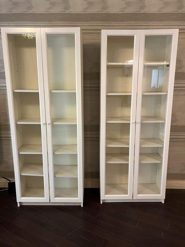 Pair of White Wooden Bookcases with Glass Doors