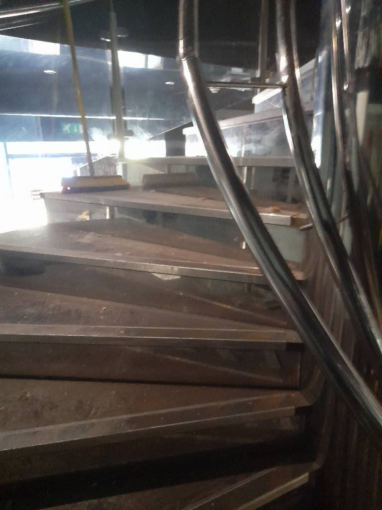 Stunning open plan spiral wide staircase,  oak floor, glass sides and stainless steel pillow