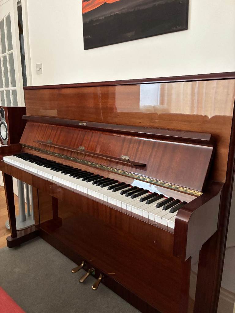Petrof upright piano P115 in polished mahogany