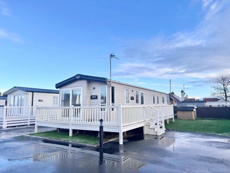 CARAVAN WITH WRAP AROUND DECKING NORTH WALES 